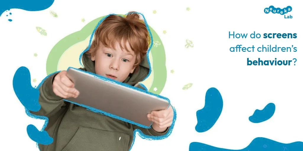 Surprised boy holding a tablet; question: how do screens affect children’s behaviour?