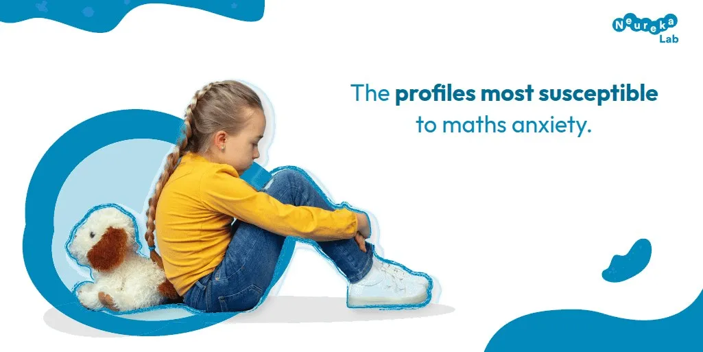 Sad girl sitting on the floor hugging her knees; the profiles most susceptible to maths anxiety.
